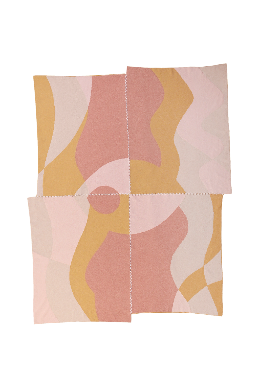 front side of abstract knit blanket with hand-stitched seam in pink, yellow and beige wool