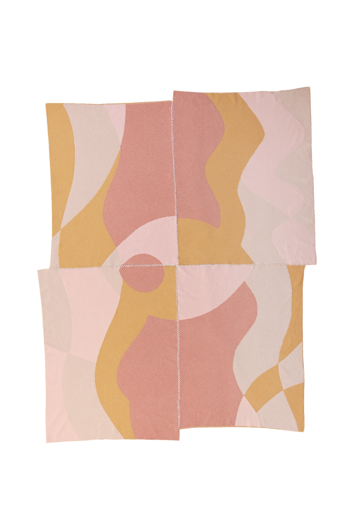 front side of abstract knit blanket with hand-stitched seam in pink, yellow and beige wool