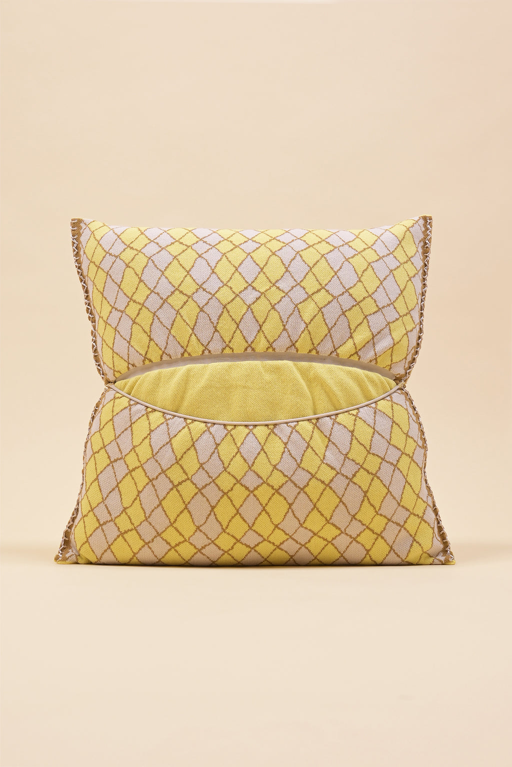 back side of yellow bow-shaped knit pillowcase with romb pattern in viscose