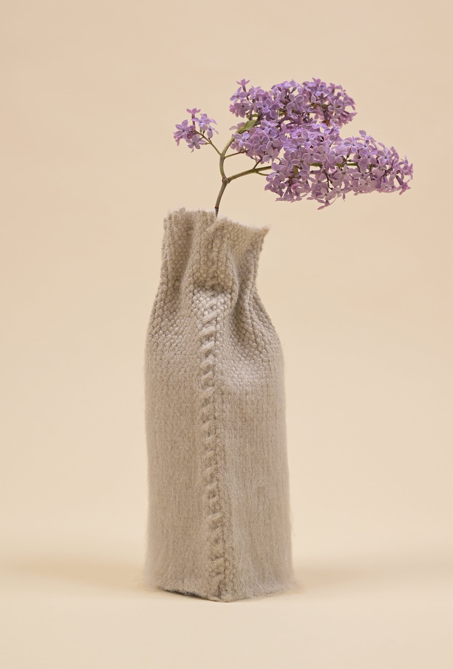 back view of beige knit textile vase in brushed silk and organic cotton