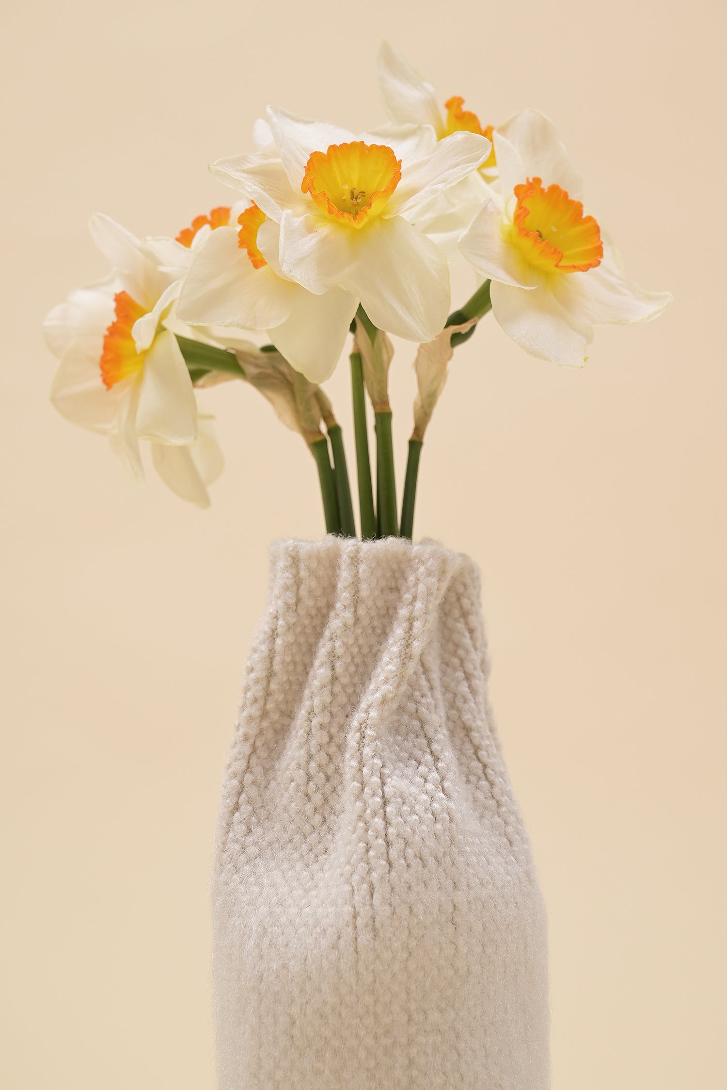 close-up of off-white knit textile vase in brushed silk and organic cotton