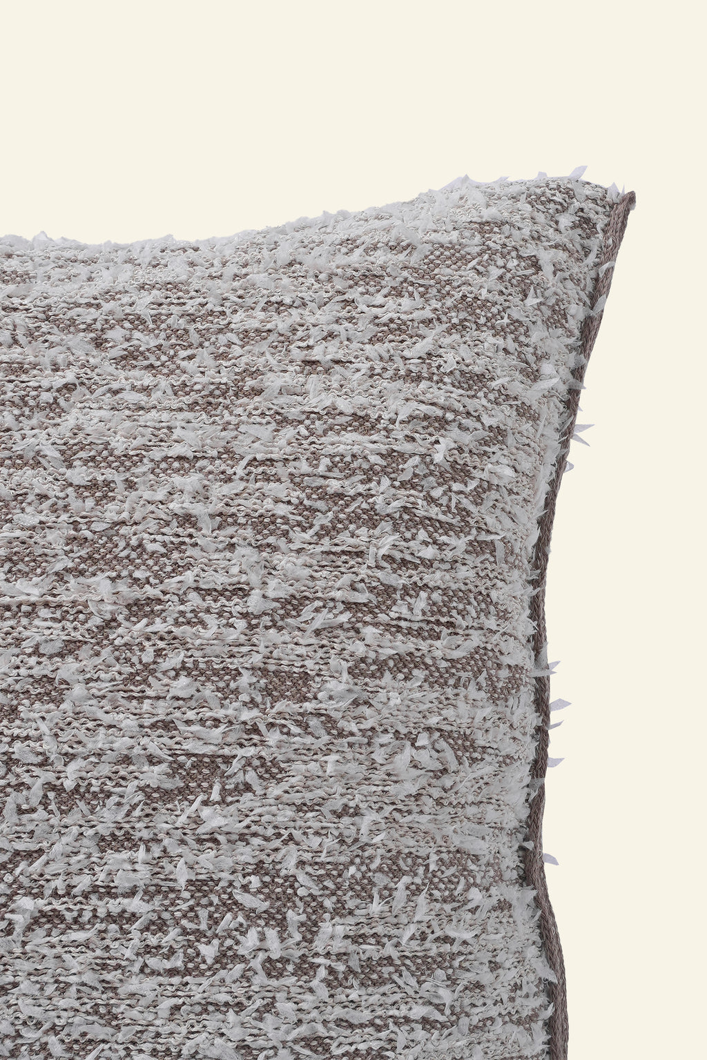 close-up of beige fuzzy knit pillowcase in organic cotton and recycled polyamide