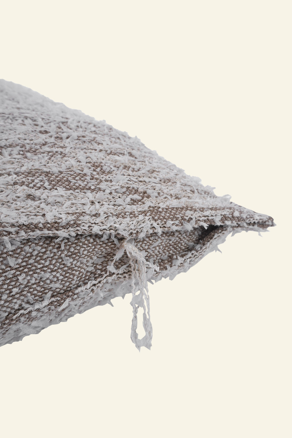 detail of beige fuzzy knit pillowcase in organic cotton and recycled polyamide