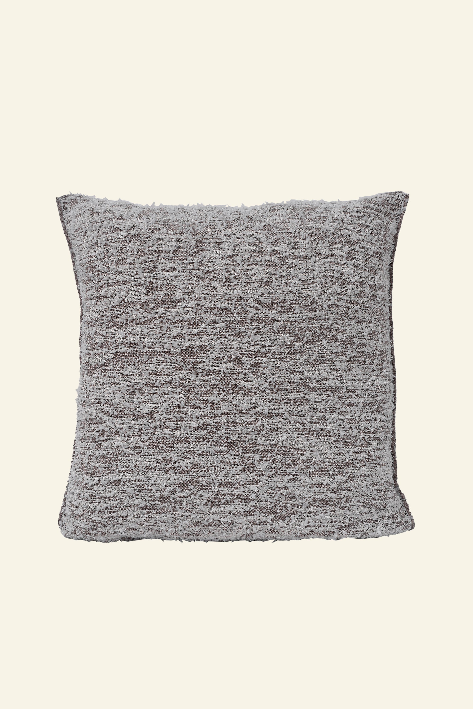 front side of beige fuzzy knit pillowcase in organic cotton and recycled polyamide on beige background