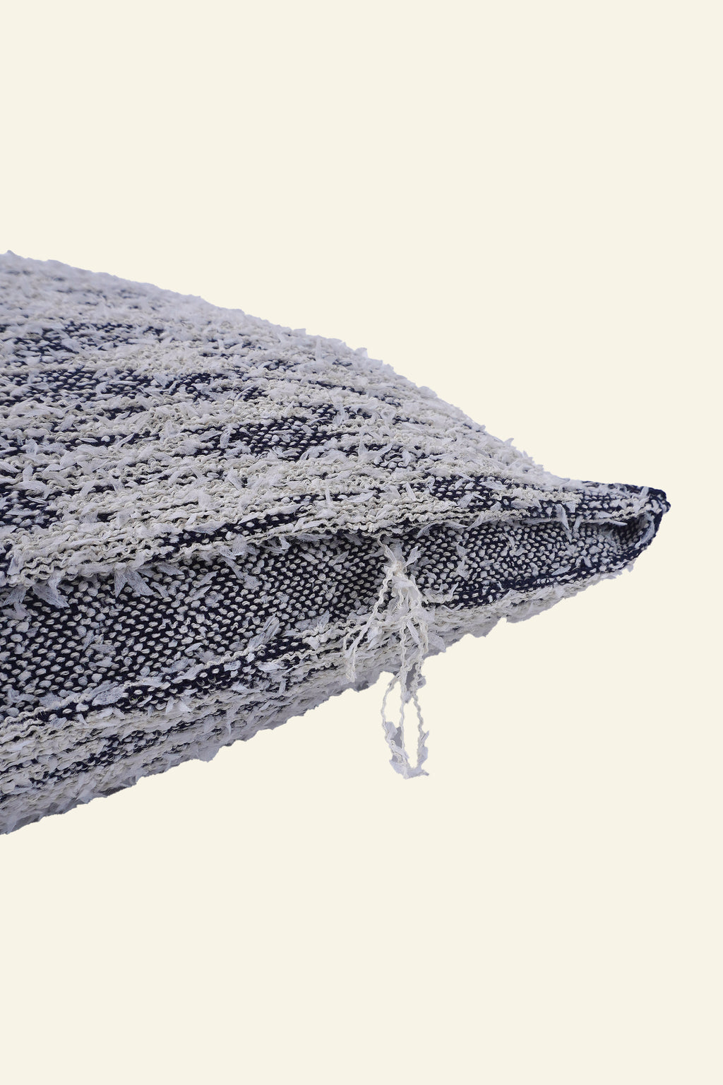 detail of navy fuzzy knit pillowcase in organic cotton and recycled polyamide