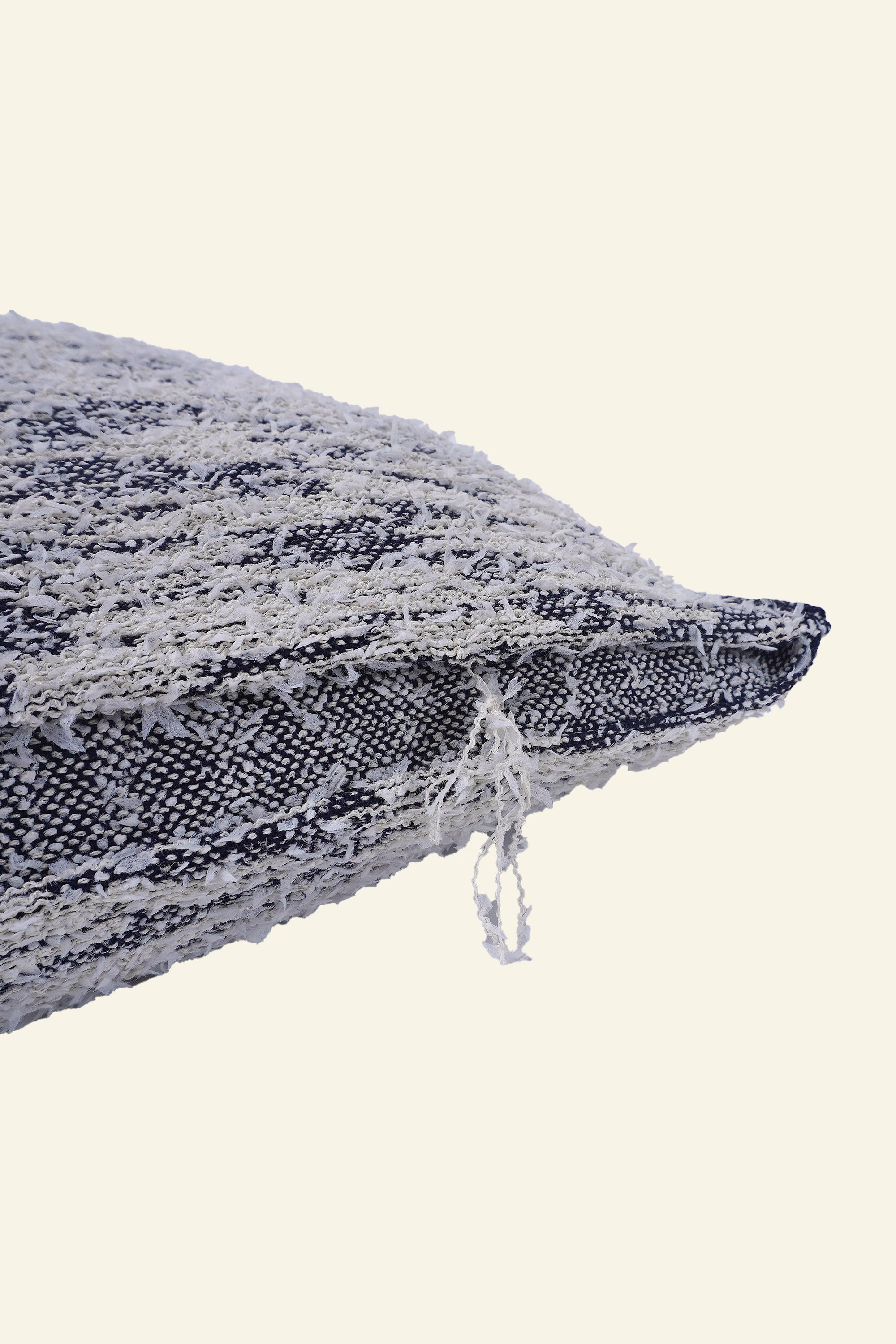 detail of navy fuzzy knit pillowcase in organic cotton and recycled polyamide