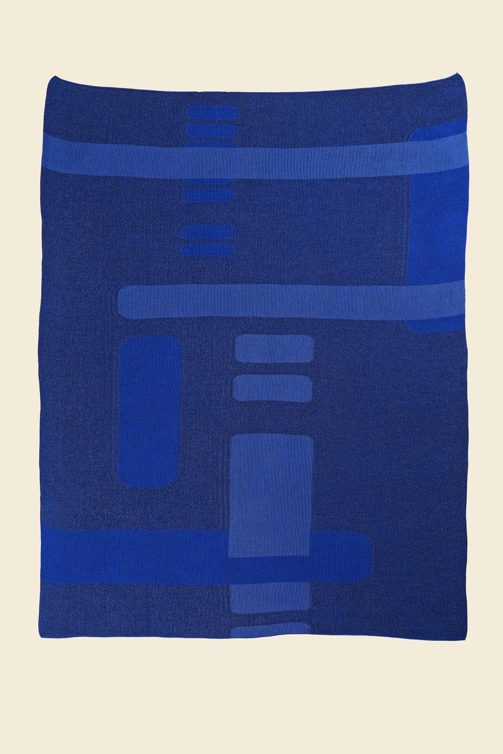 laid flat blue geometric column knit blanket in merino wool and organic cotton