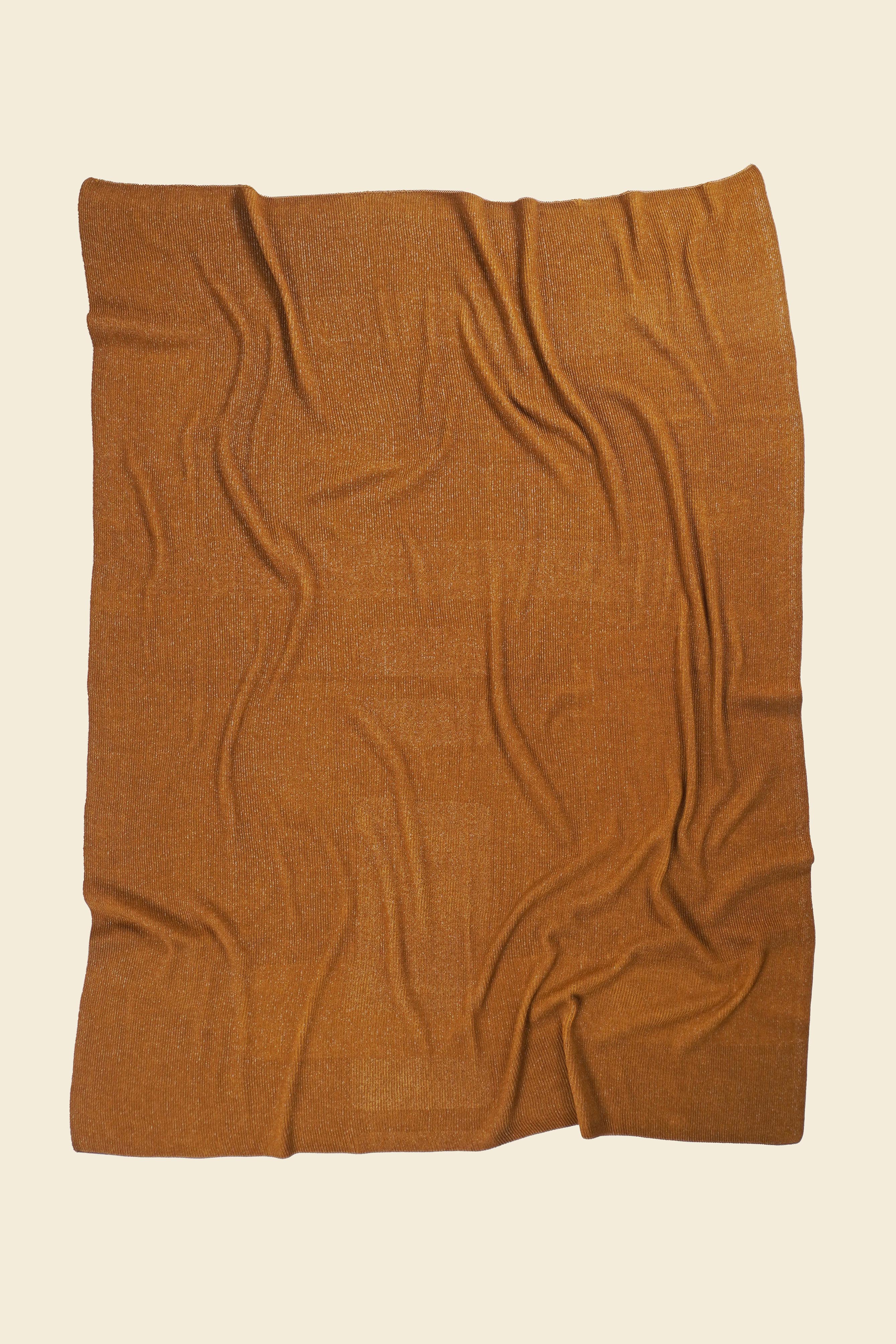 back side of ochre geometric column knit blanket in merino wool and organic cotton