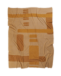 front side of ochre geometric column knit blanket in merino wool and organic cotton
