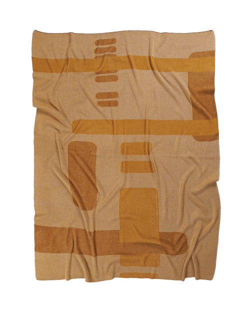 front side of ochre geometric column knit blanket in merino wool and organic cotton