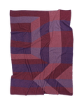 front side red/purple geometric ikat knit blanket in merino wool and organic cotton