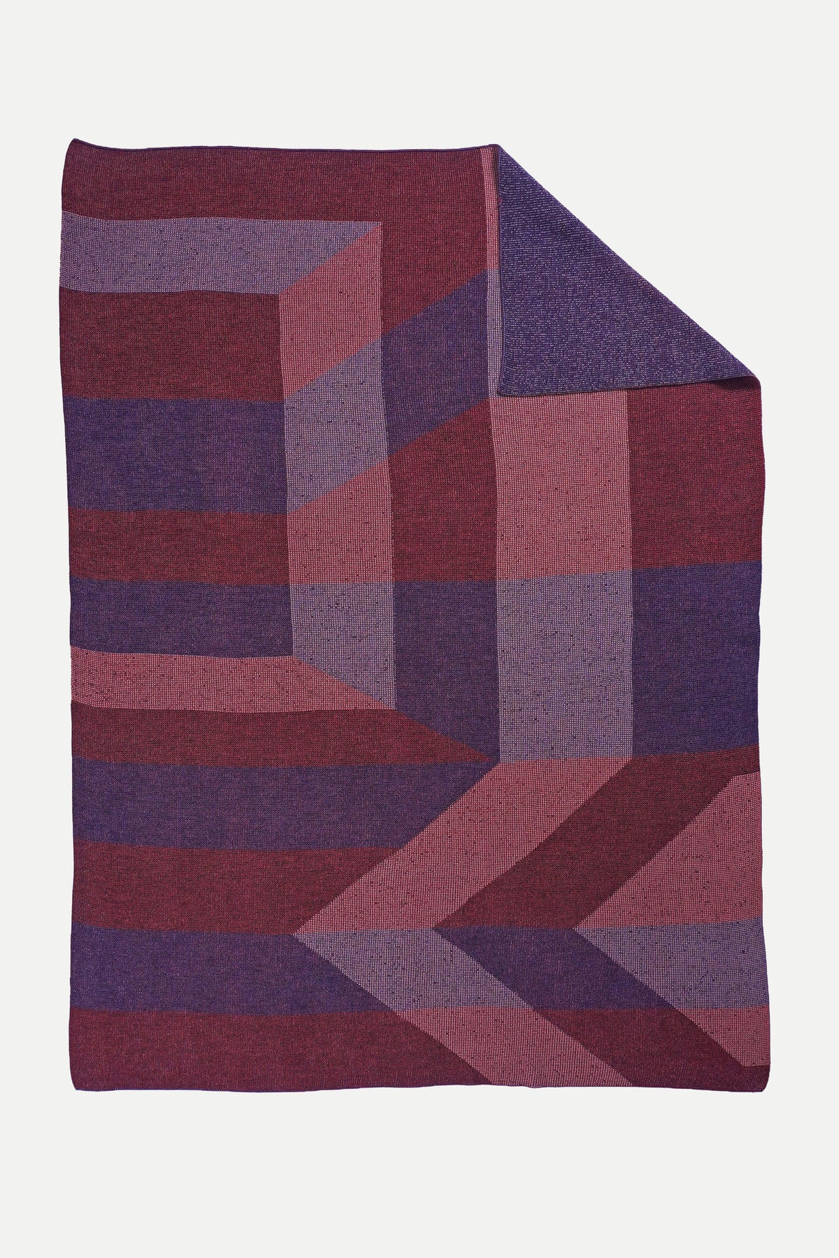 geometric ikat knit blanket in red and purple, flat lay, wool and organic cotton [red/purple]