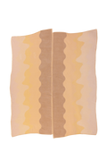 top view of organic cotton knit tablecloth with hand-stitched seam in yellow monochrome tones