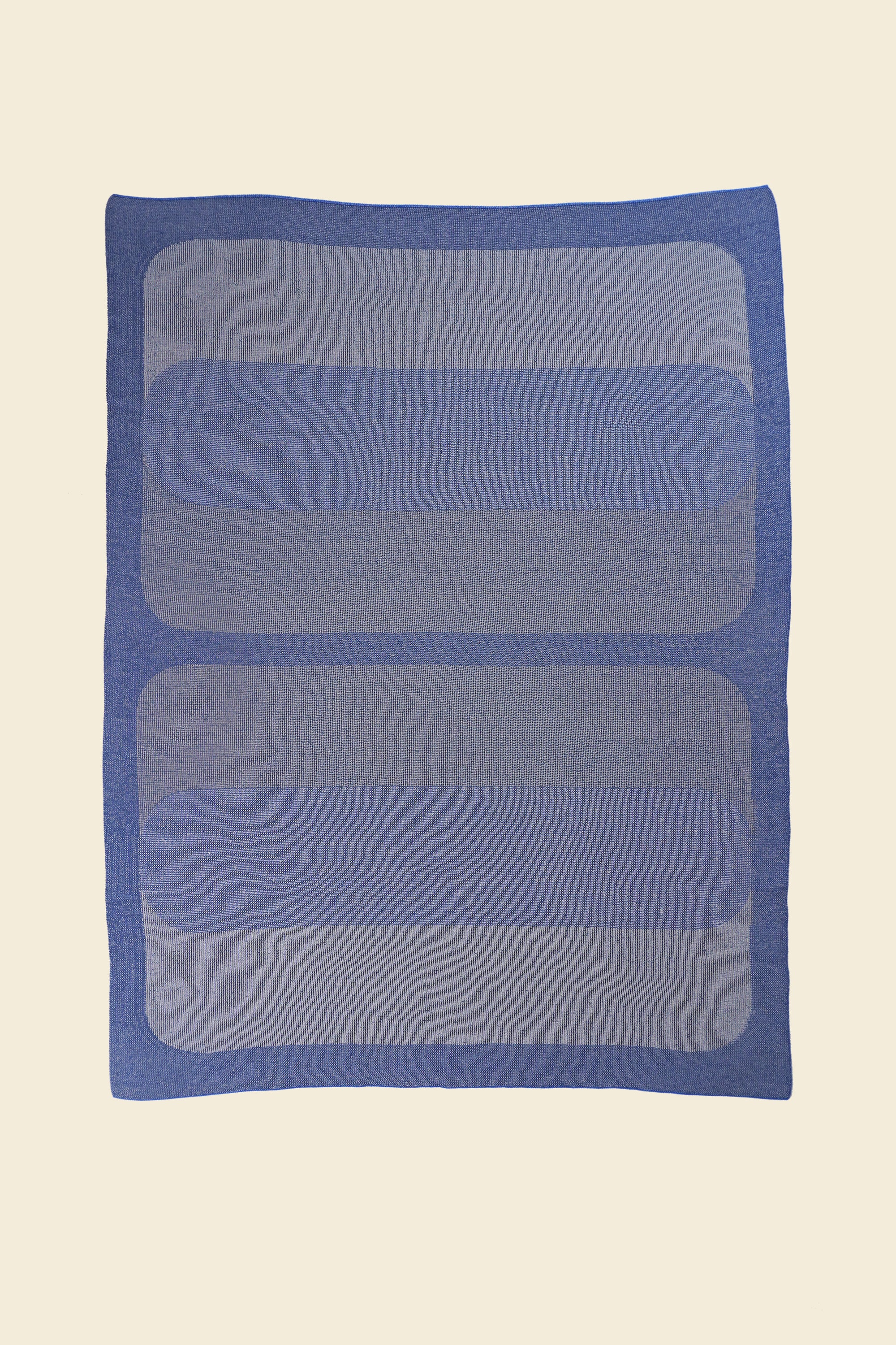 laid flat grey/blue knit blanket with rectangles in merino wool and organic cotton