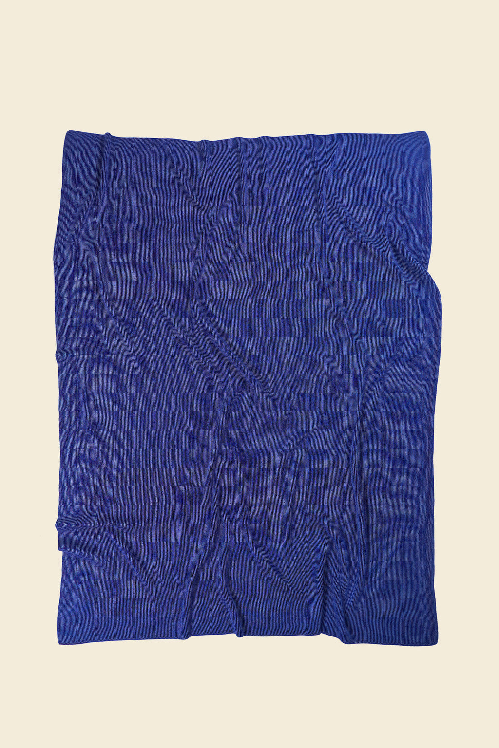 back side of purple/blue knit blanket in merino wool and organic cotton