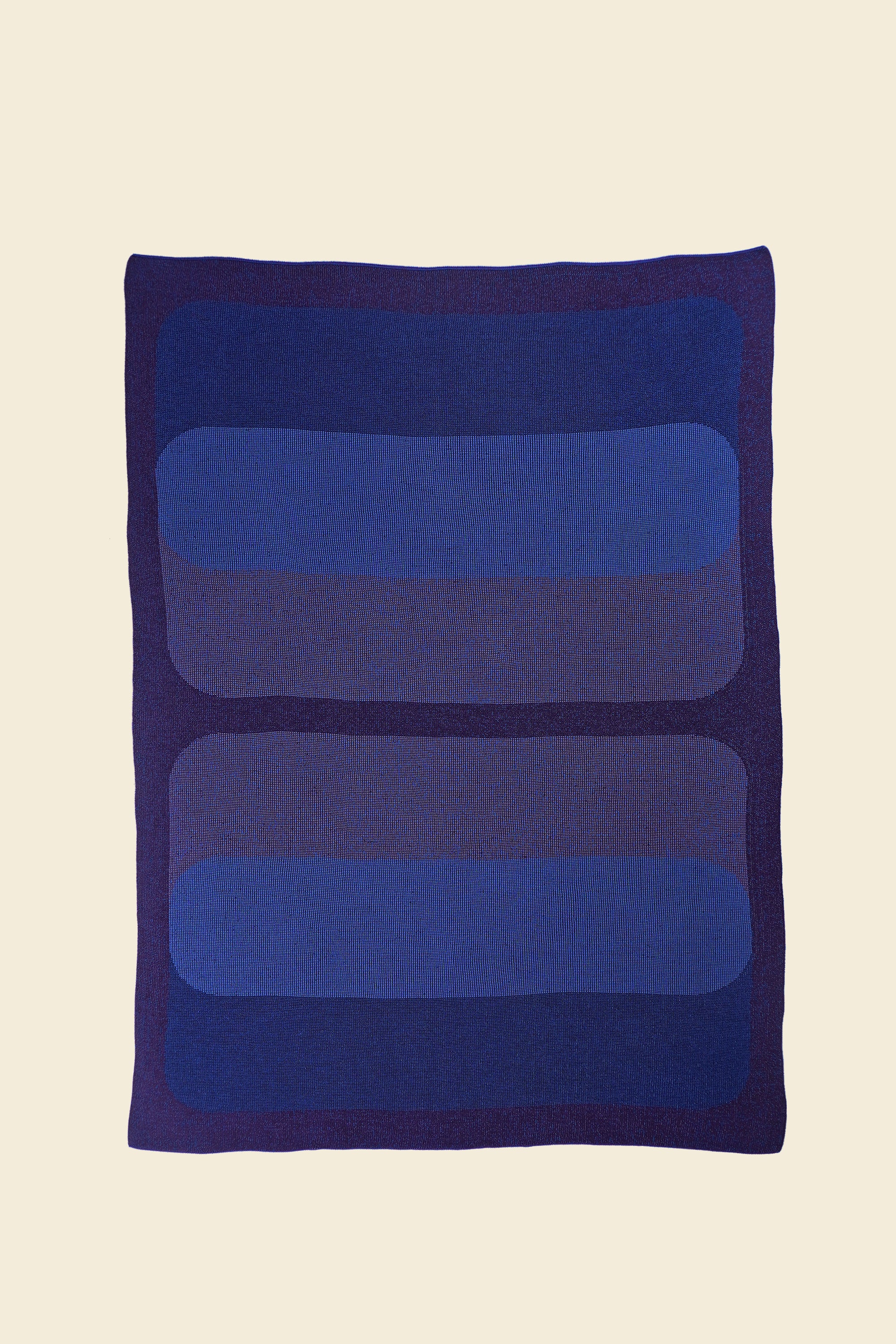 laid flat purple/blue knit blanket with rectangles in merino wool and organic cotton