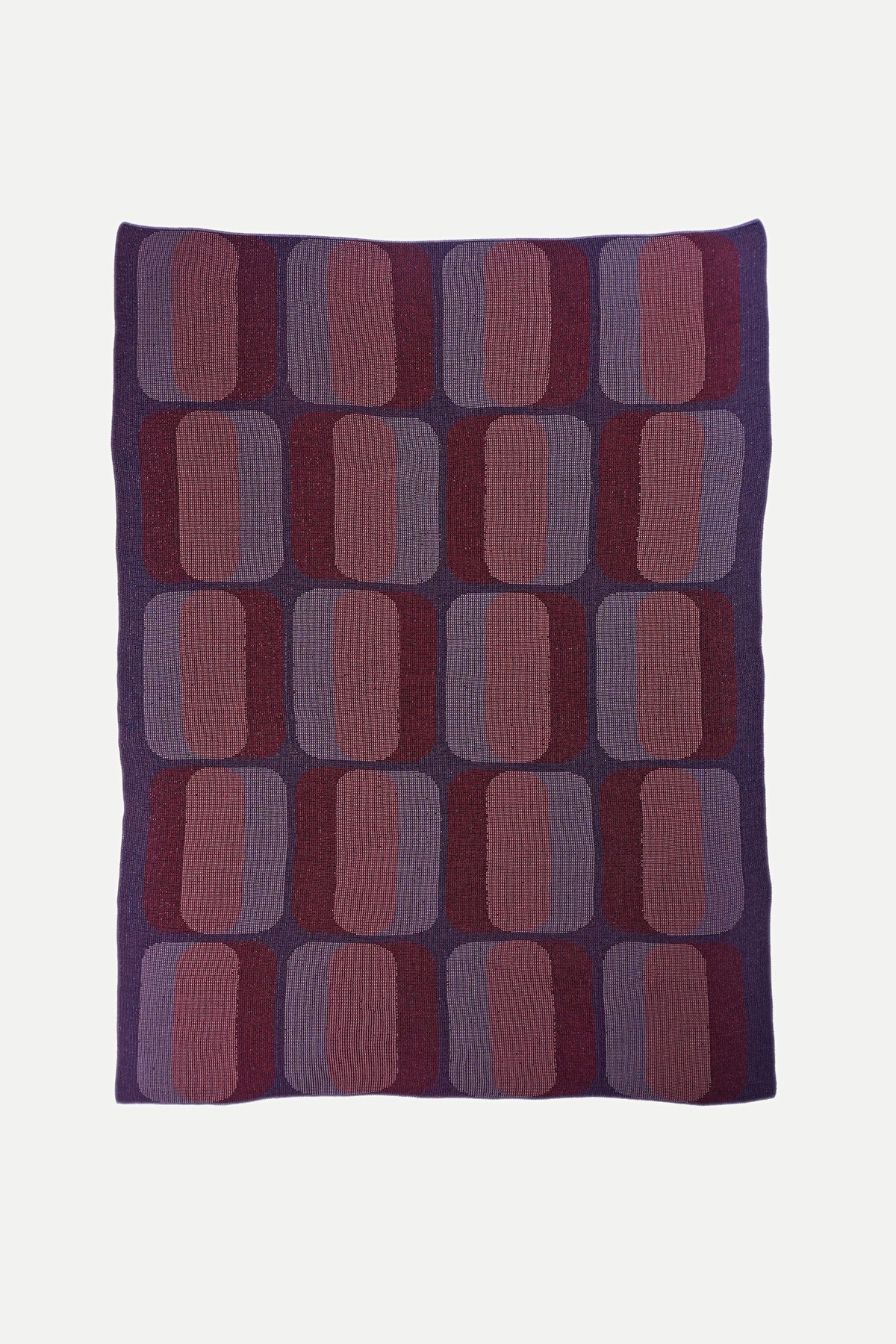 mini-graphic knit blanket in red and purple, detail of geometric pattern, wool and organic cotton [red/purple]