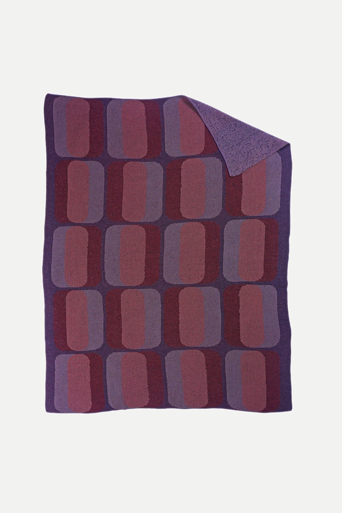 reverse side of mini-graphic knit blanket in red and purple, solid knit texture, wool and organic cotton [red/purple] [open]