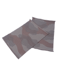 top view of beige knit organic cotton table mat with abstract design in pair