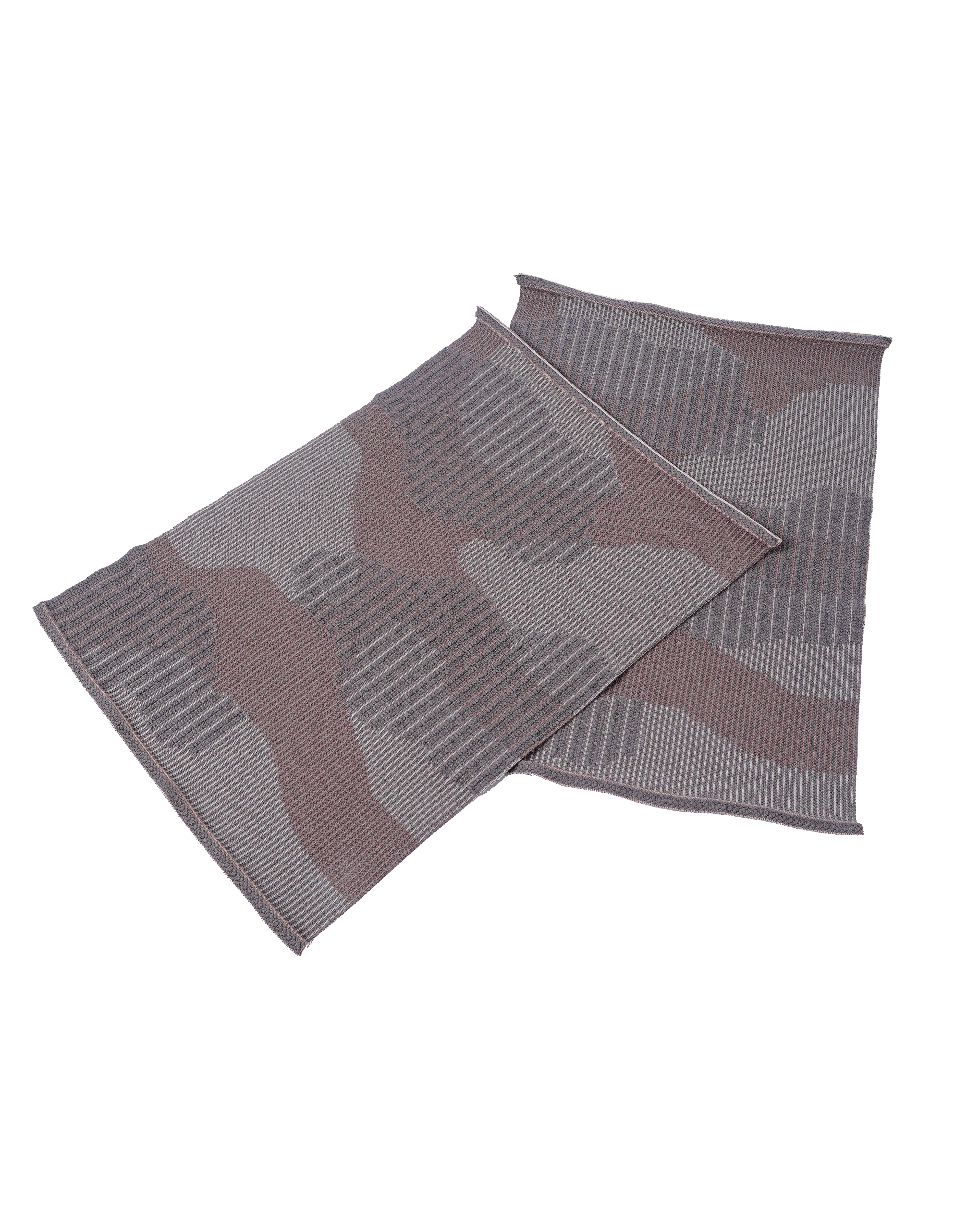 top view of beige knit organic cotton table mat with abstract design in pair