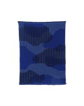 top view of blue knit organic cotton table mat with abstract design