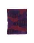 top view of red knit organic cotton table mat with abstract design
