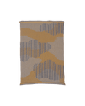 top view of yellow knit organic cotton table mat with abstract design