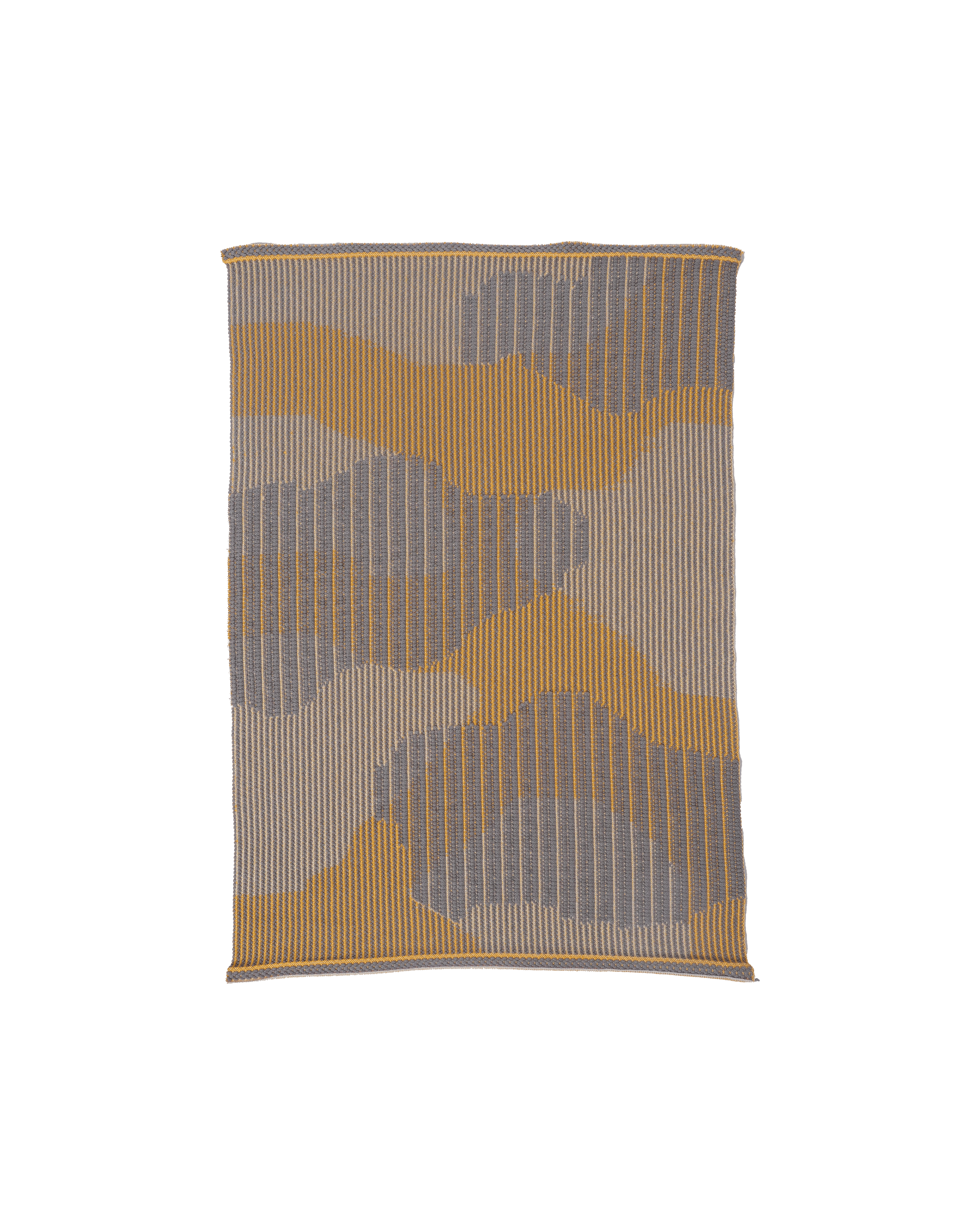 top view of yellow knit organic cotton table mat with abstract design