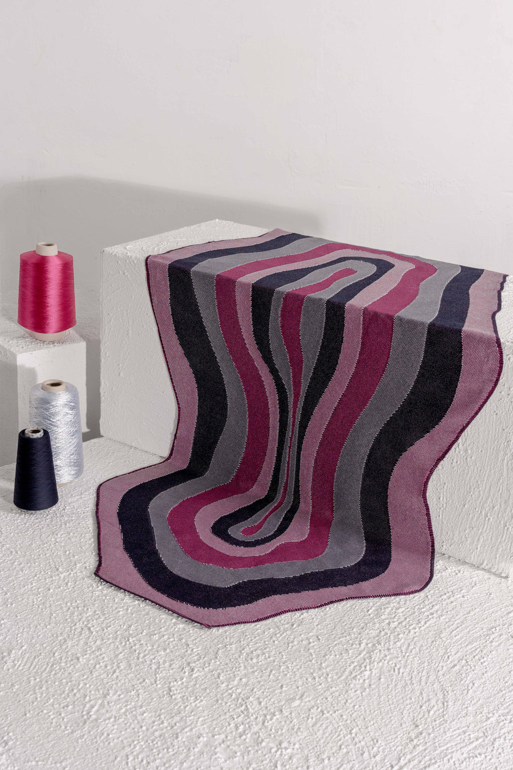 organic cotton knit tablecloth with curved edges in purple and navy on white display