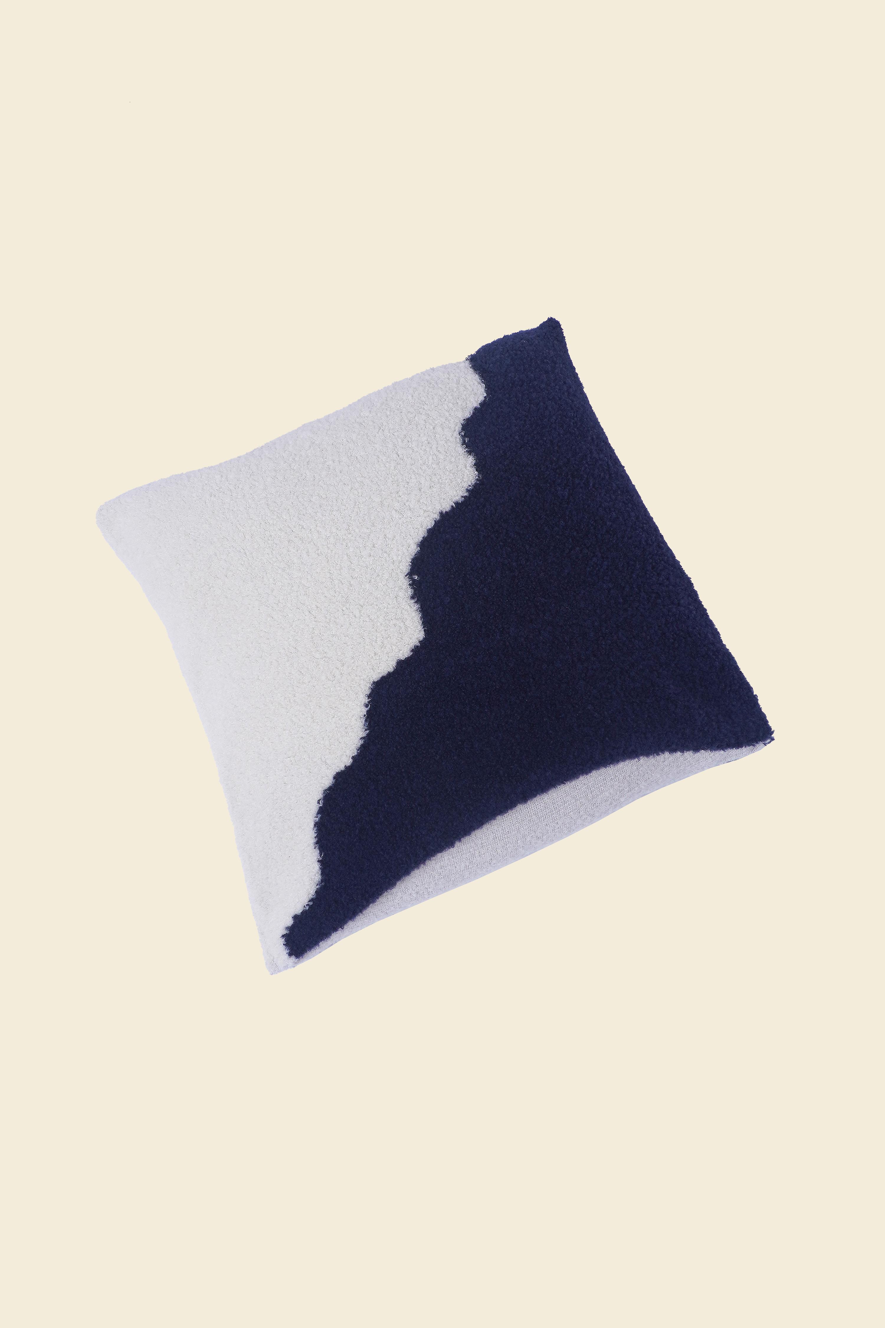 flat laid off-white/navy knit plush pillowcase in viscose and merino wool
