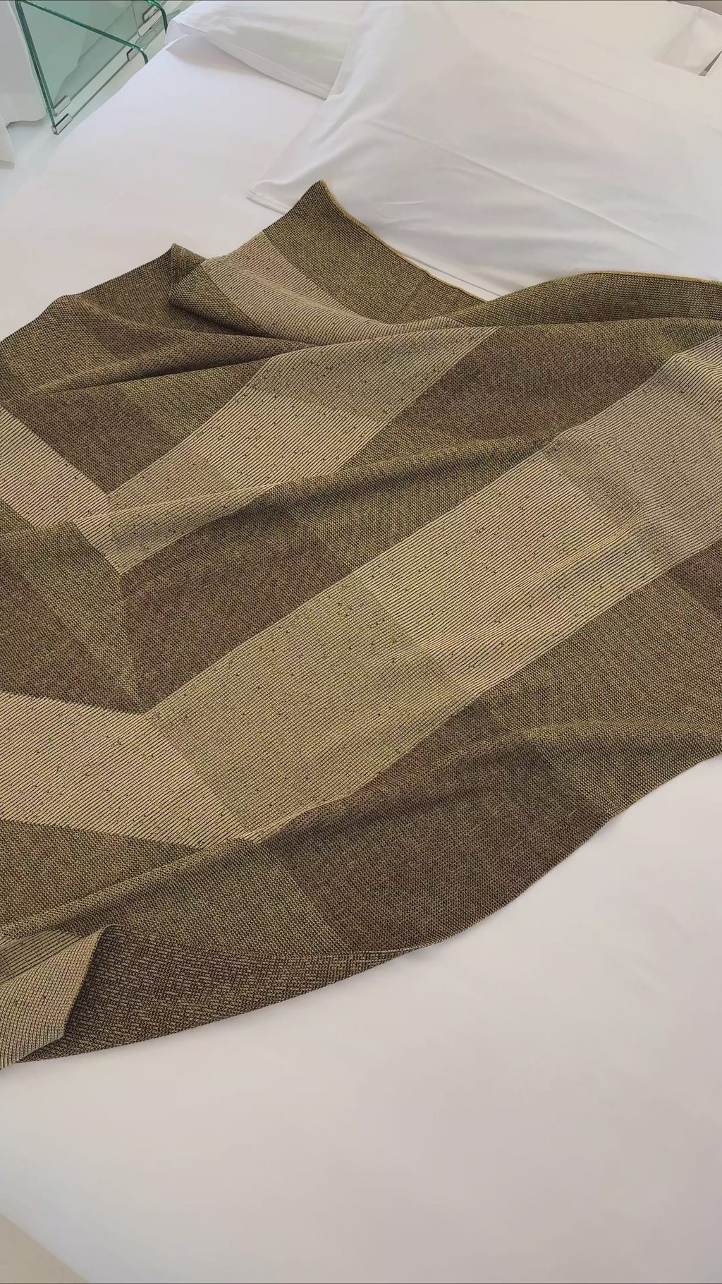 video of brown/gold blanket on bed
