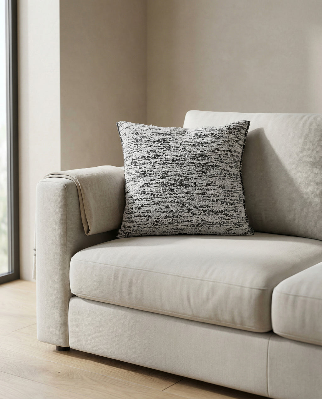 navy fuzzy knit pillowcase on sofa