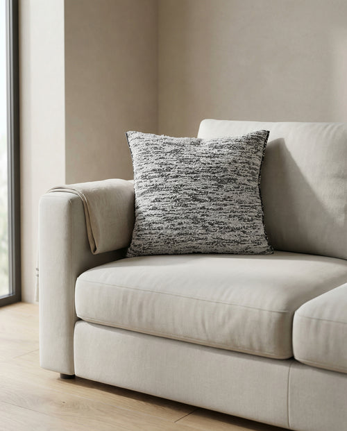 navy fuzzy knit pillowcase on sofa