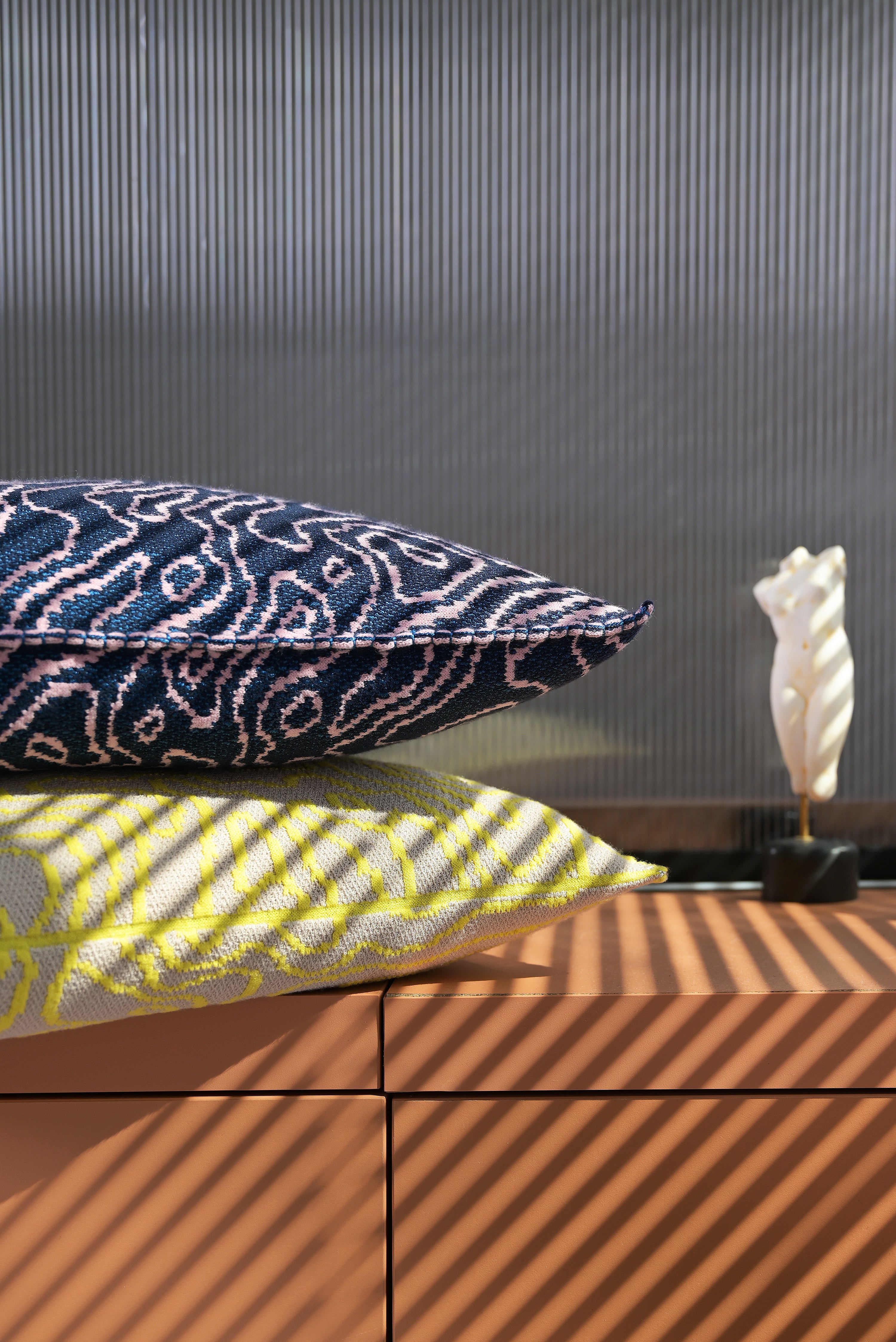 close-up of yellow/beige soft viscose knit pillowcase with organic curves pattern