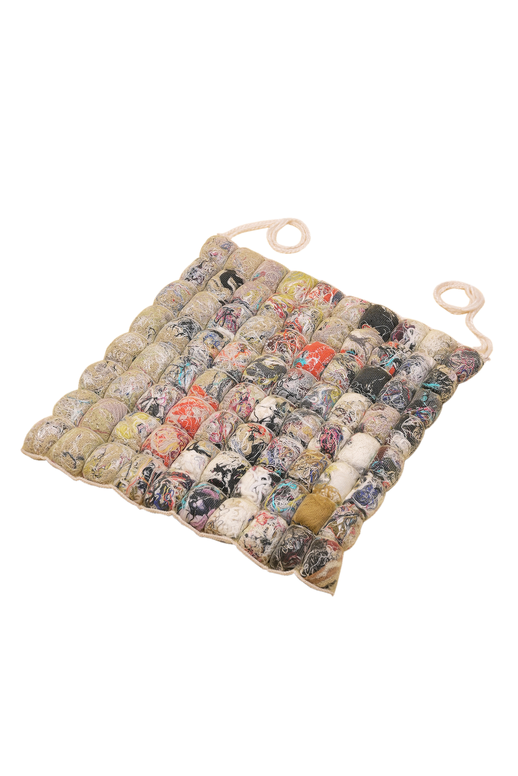 front view of knit seat cushion with transparent cover filled with upcycled materials