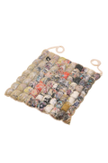 front view of knit seat cushion with transparent cover filled with upcycled materials