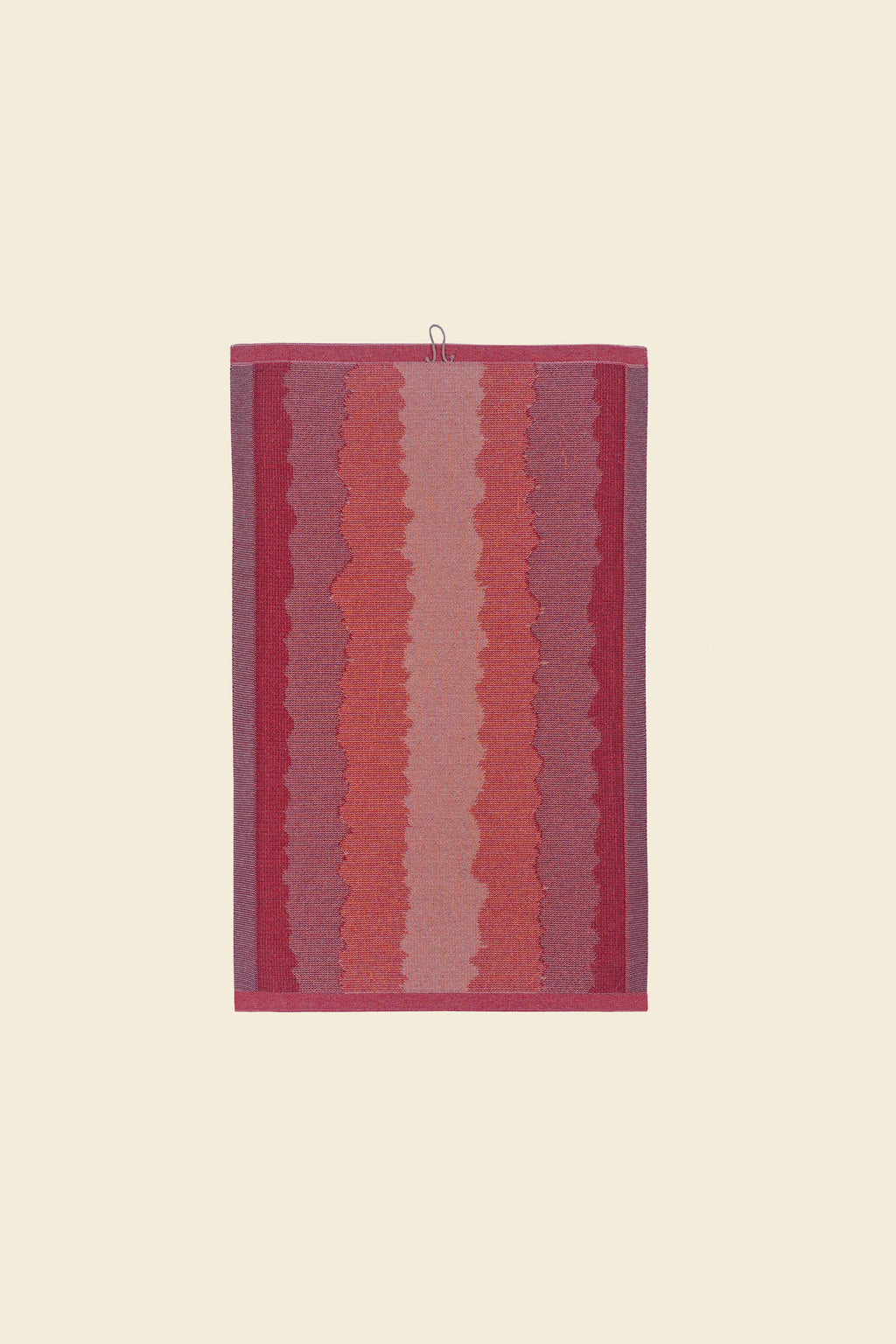 back side of red knit organic cotton kitchen towel with wavy pattern