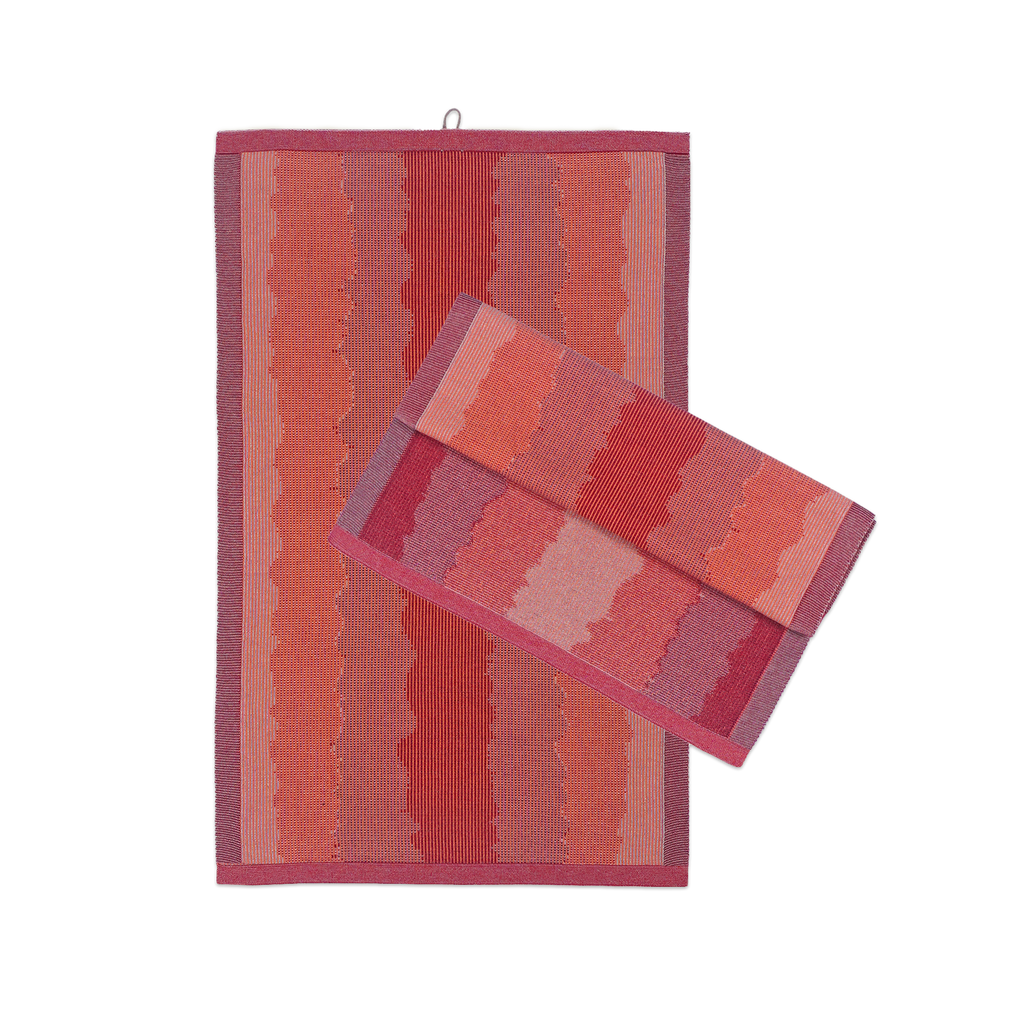 front view of red knit organic cotton kitchen towel set with wavy pattern