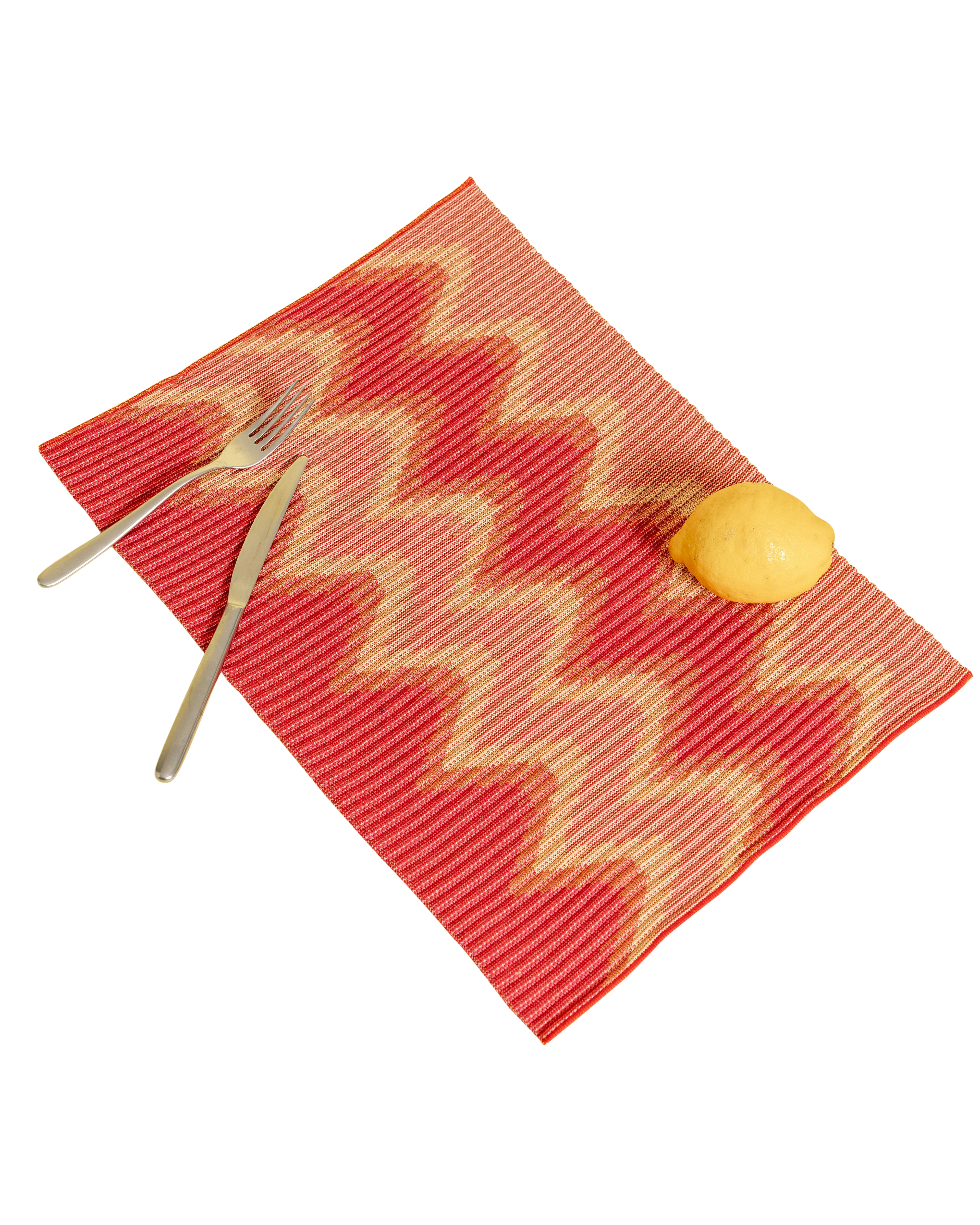 top view of red/yellow knit table mat in organic cotton and viscose with wavy pattern