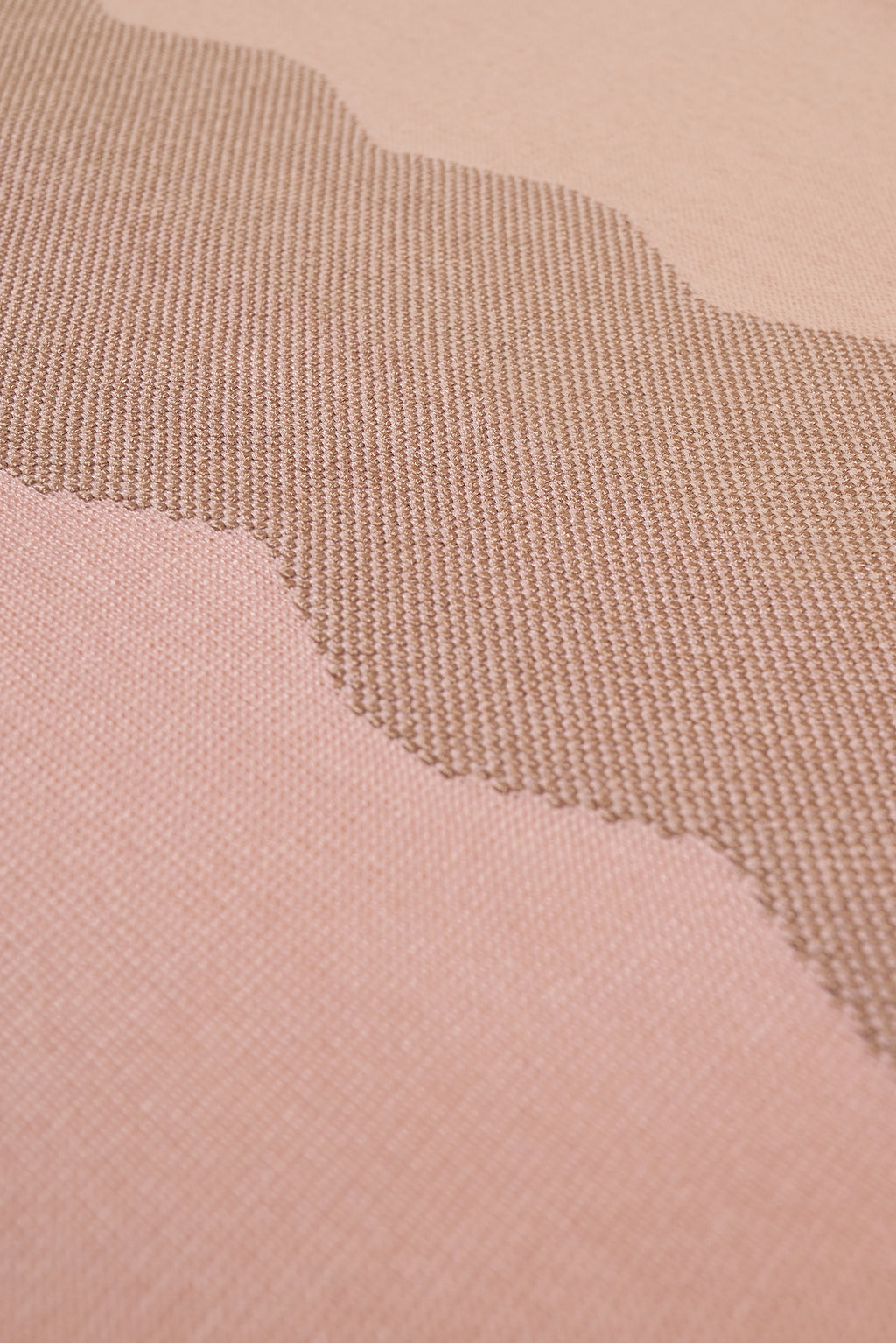 detail of wavy knit organic cotton table runner in pink  