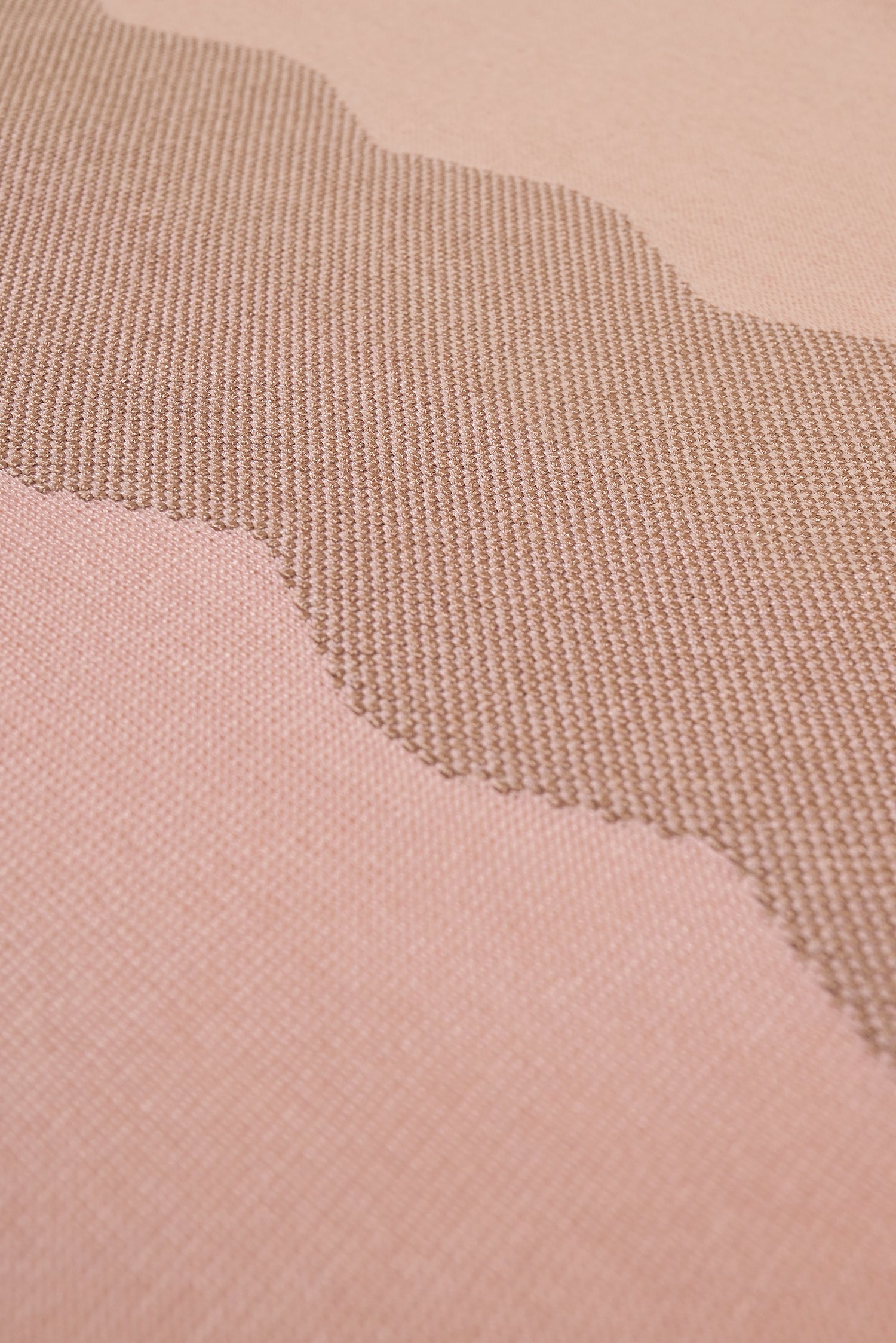 detail of wavy knit organic cotton table runner in pink  