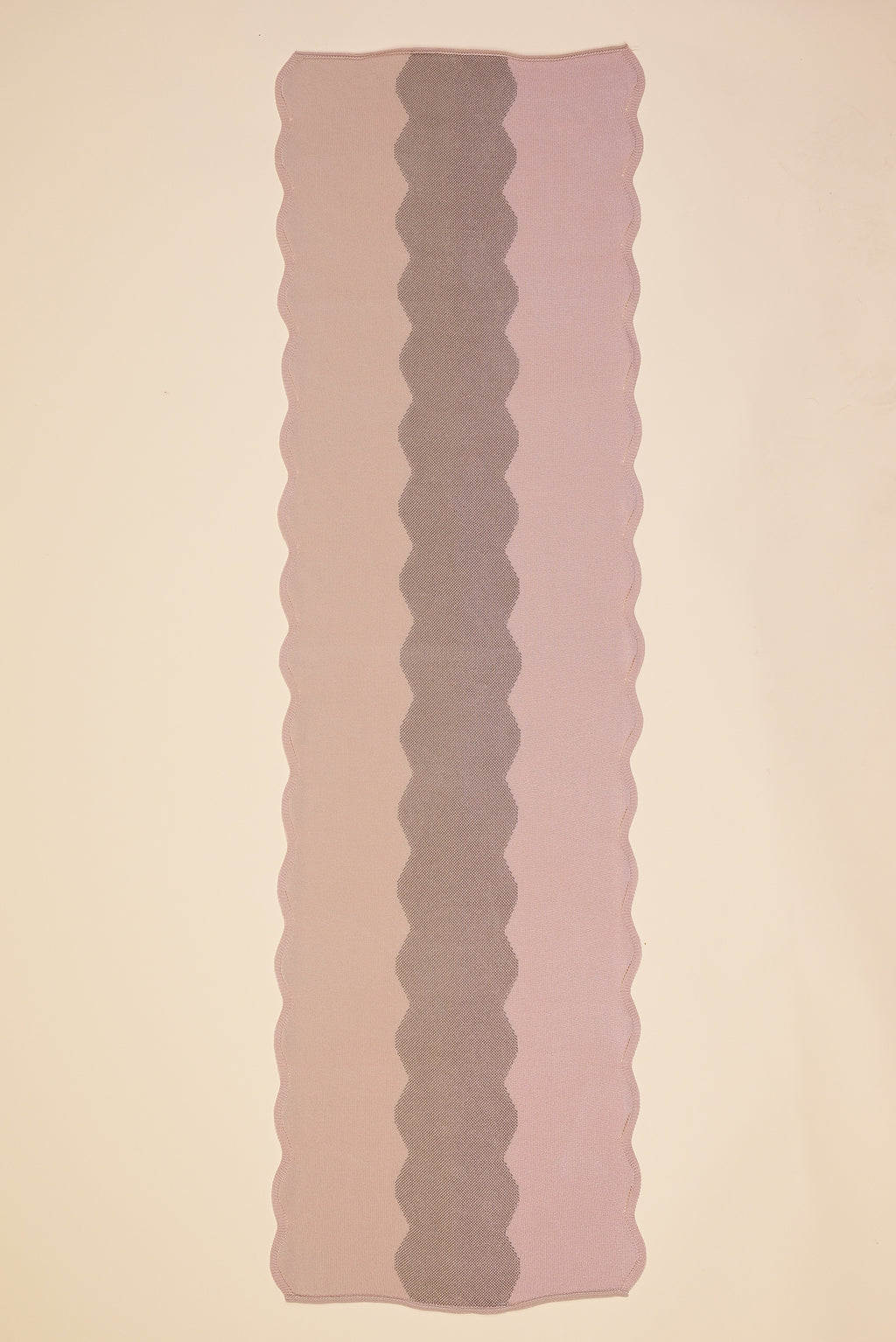 top view of wavy knit organic cotton table runner in pink  