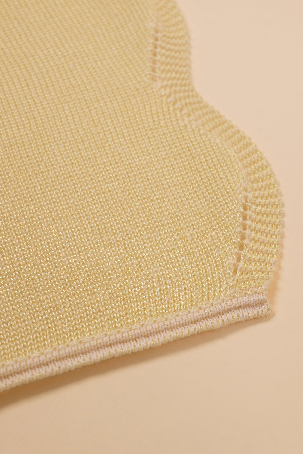 corner of wavy knit organic cotton table runner in yellow