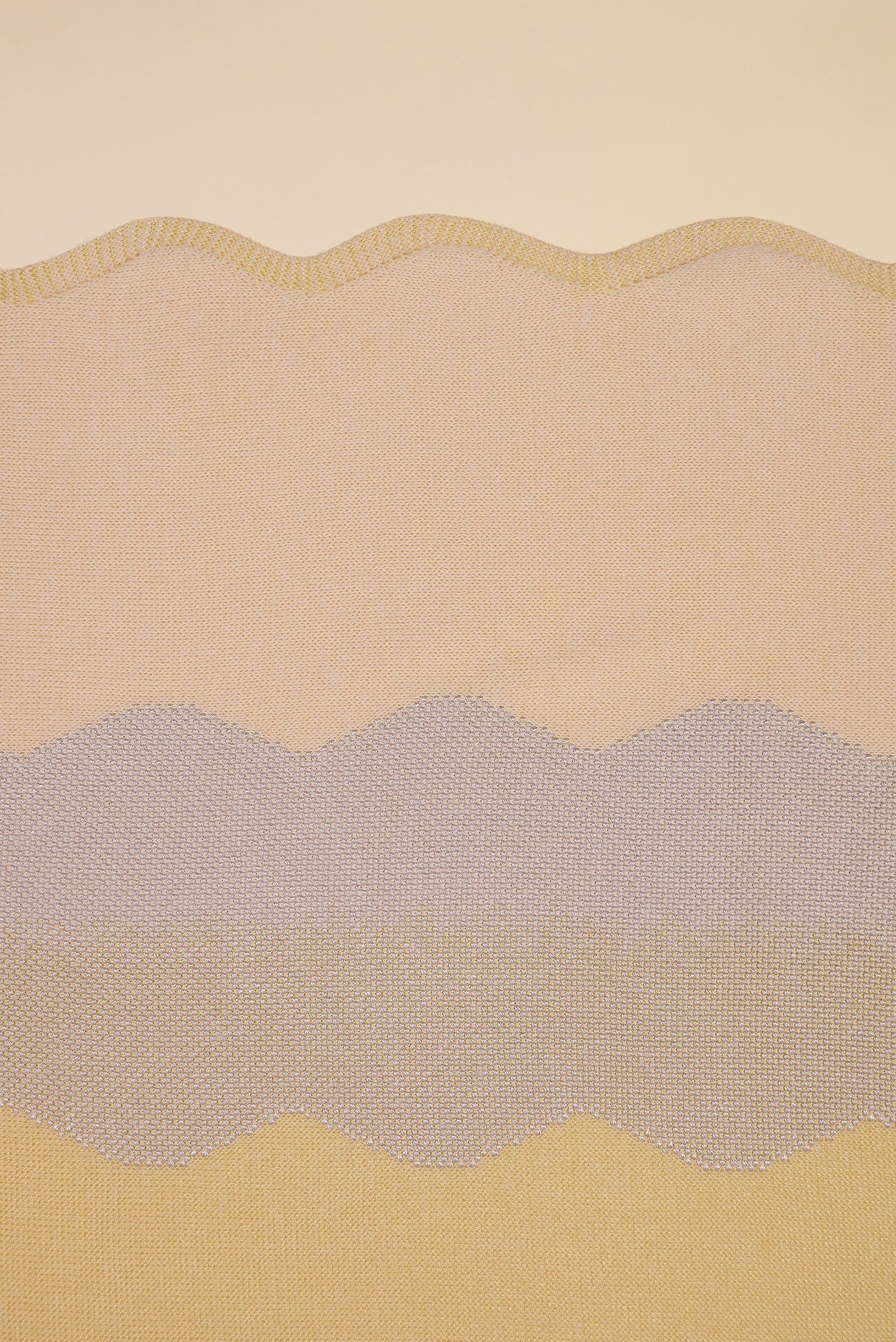 detail of wavy knit organic cotton table runner in yellow