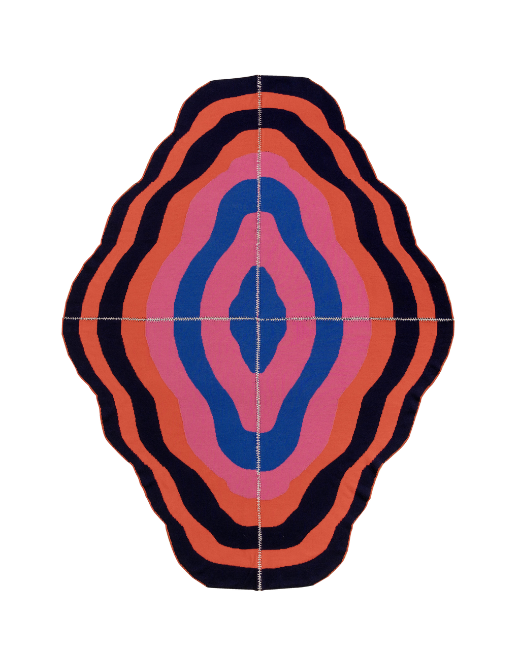 dark wavy knit wool blanket with hand-stitched seam in blue, pink, red and navy 