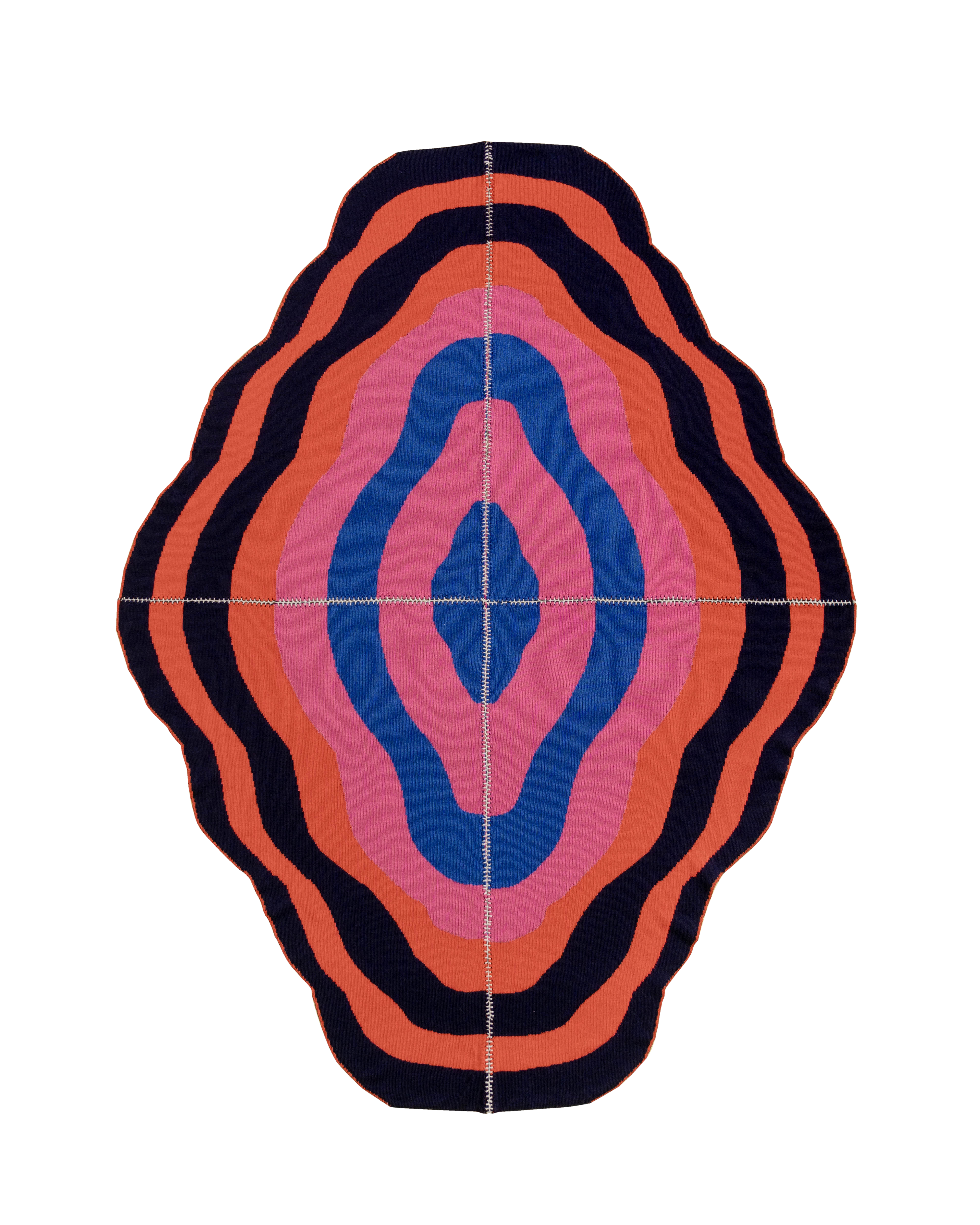 dark wavy knit wool blanket with hand-stitched seam in blue, pink, red and navy 