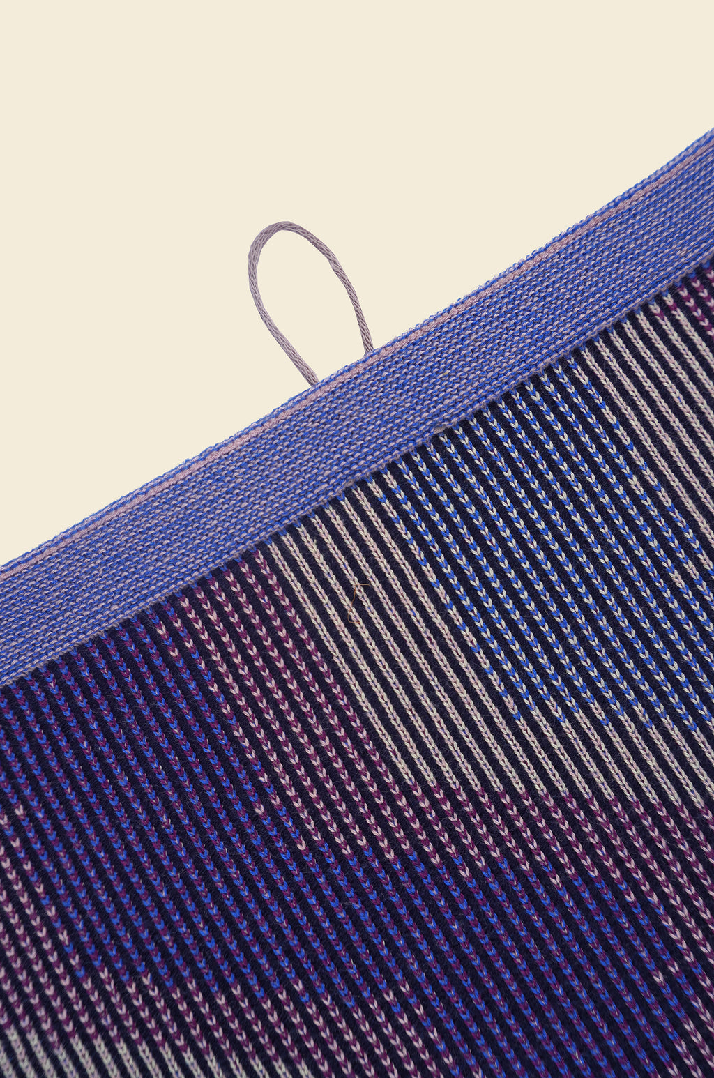 top detail of purple knit organic cotton kitchen towel with zig zag pattern