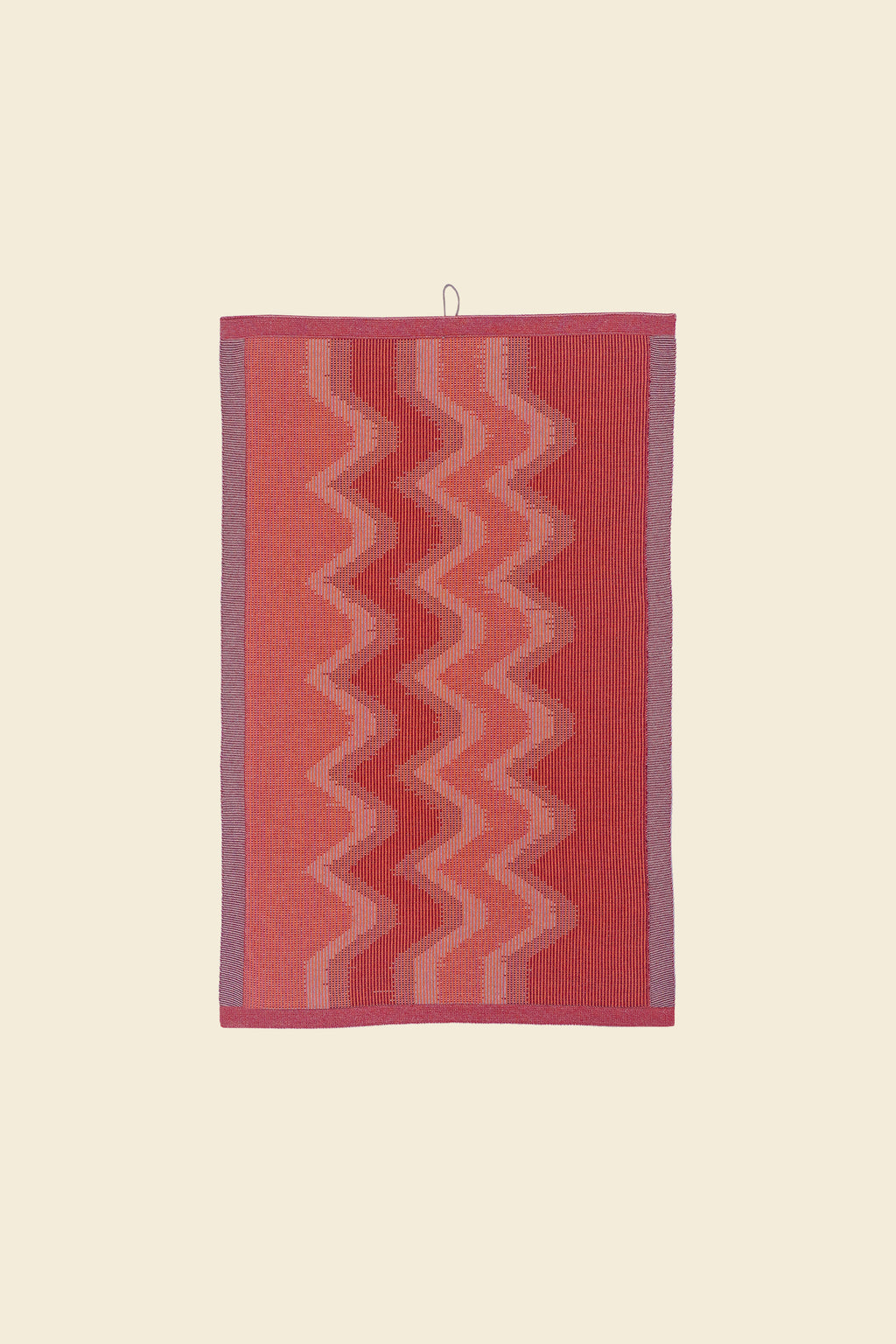 front view of red knit organic cotton kitchen towel with zig zag pattern