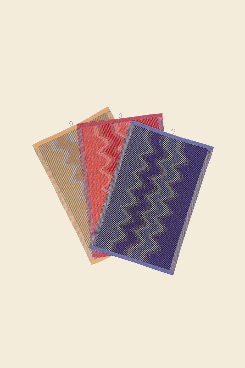 front view of yellow, red and purple knit organic cotton kitchen towel set with zig zag pattern
