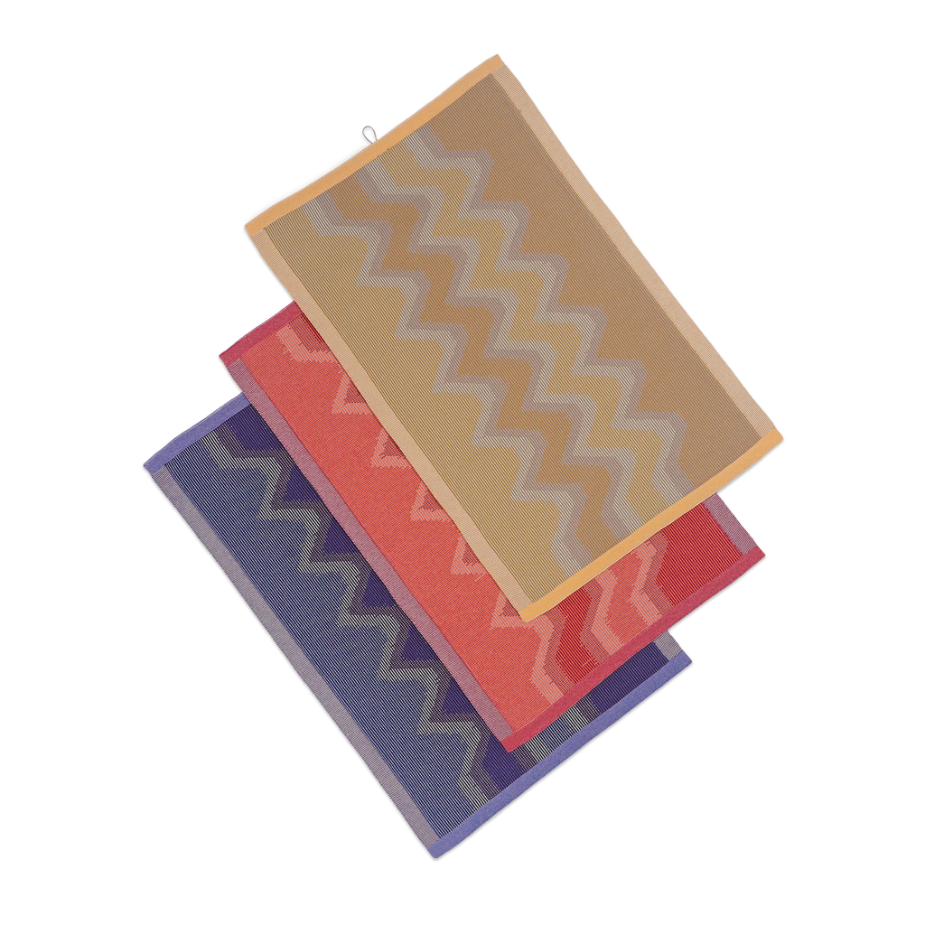 top view of yellow, red and purple knit organic cotton kitchen towel set with zig zag pattern